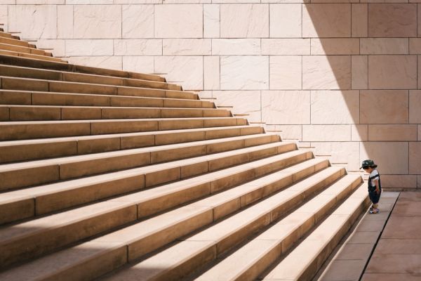 Small boy at the foot of a steep flight of steps
